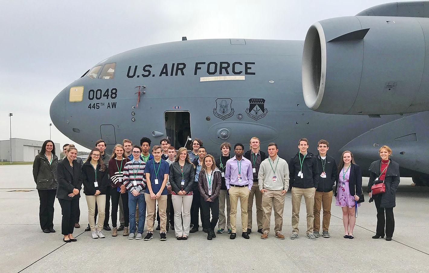 group photo with transport plane